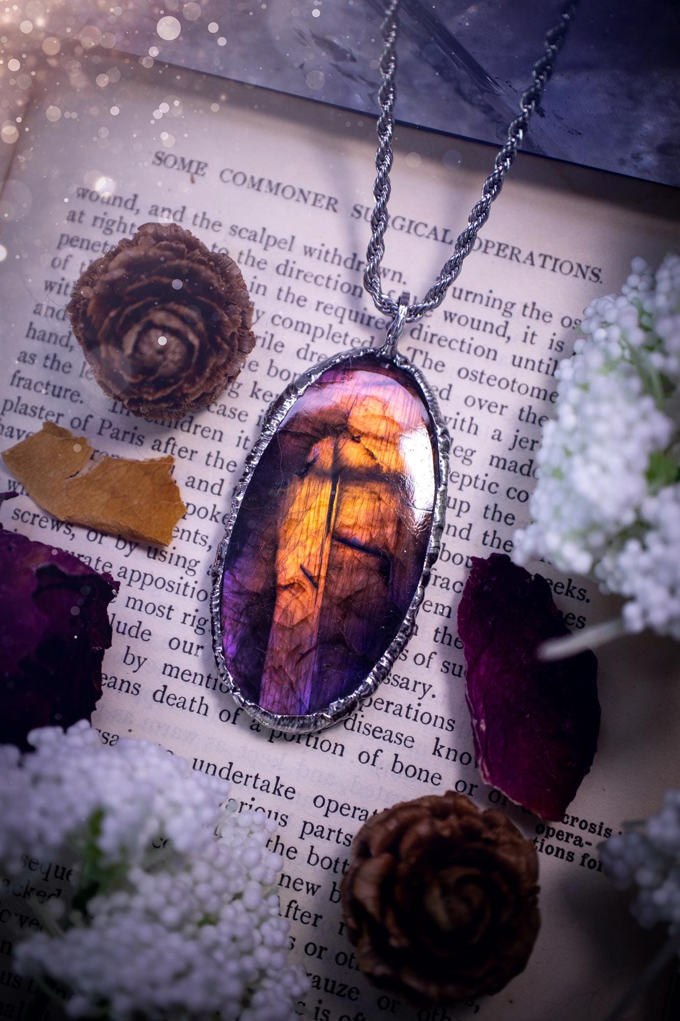The ultimate labradorite soft soldered pendant necklace. This pendant necklace features the most beautiful and natural Labradorite spectrolite crystal that has so many hues of purple, pink and orange. Handmade using the tiffany technique, also known as soft soldering. This piece is made from solder which contains metals and silver and is safe to wear. The ideal gift for any jewellery lover and crystal collector! Witchy, gothic and hippy jewellery that has been made for the soul.