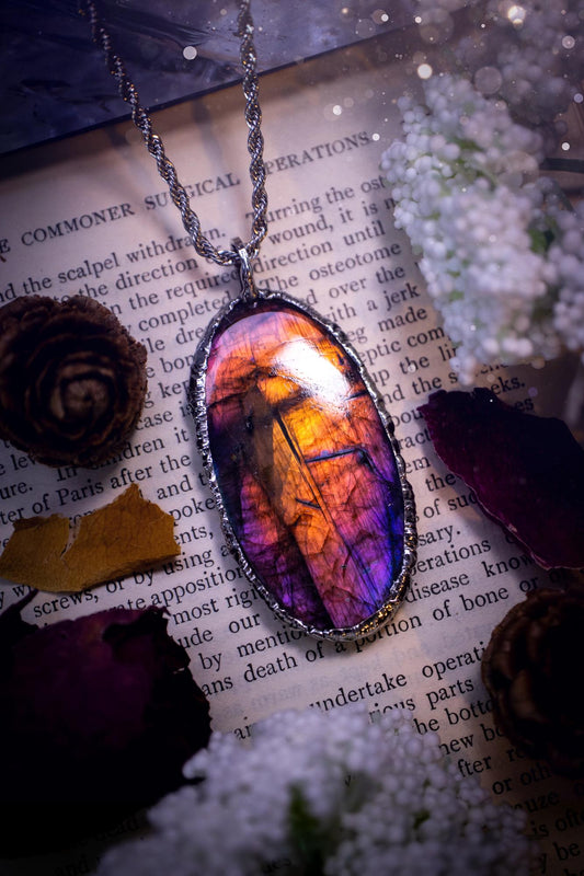 The ultimate labradorite soft soldered pendant necklace. This pendant necklace features the most beautiful and natural Labradorite spectrolite crystal that has so many hues of purple, pink and orange. Handmade using the tiffany technique, also known as soft soldering. This piece is made from solder which contains metals and silver and is safe to wear. The ideal gift for any jewellery lover and crystal collector! Witchy, gothic and hippy jewellery that has been made for the soul.