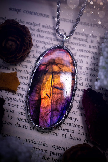 The ultimate labradorite soft soldered pendant necklace. This pendant necklace features the most beautiful and natural Labradorite spectrolite crystal that has so many hues of purple, pink and orange. Handmade using the tiffany technique, also known as soft soldering. This piece is made from solder which contains metals and silver and is safe to wear. The ideal gift for any jewellery lover and crystal collector! Witchy, gothic and hippy jewellery that has been made for the soul.