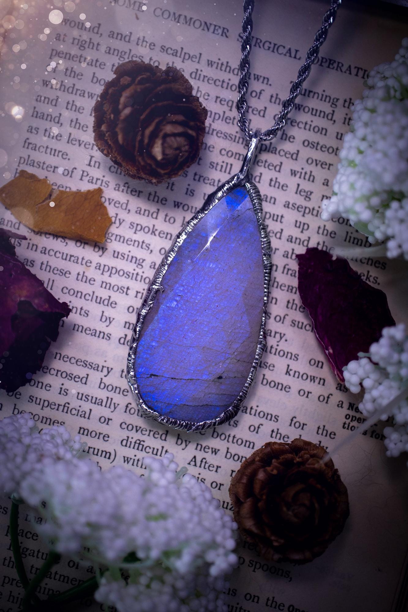 Handmade and beautiful, rose cut, belomorite, soft soldered pendant necklace. This pendant necklace features the most gorgeous and flashy belomorite moonstone crystal, full of glittery shimmer and a deep lovely blue hue. Handcrafted using the soft solder method, also known as the tiffany technique, an ancient technique used to created stained glass windows. The solder used is lead free and totally safe to wear, it contains elements of silver and polishes up to a high lustre. Gothic jewellery
