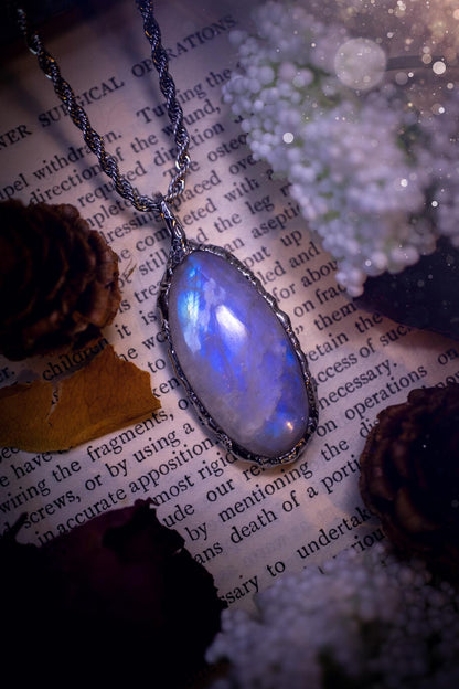Handmade and beautiful, flashy rainbow moonstone, soft soldered pendant necklace. This pendant necklace features the most gorgeous and flashy rainbow moonstone crystal, full of glittery shimmer and a deep lovely blue hue. Handcrafted using the soft solder method, also known as the tiffany technique, an ancient technique used to created stained glass windows. The solder used is lead free and totally safe to wear, it contains elements of silver and polishes up to a high lustre. Gothic jewellery