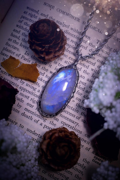 Handmade and beautiful, flashy rainbow moonstone, soft soldered pendant necklace. This pendant necklace features the most gorgeous and flashy rainbow moonstone crystal, full of glittery shimmer and a deep lovely blue hue. Handcrafted using the soft solder method, also known as the tiffany technique, an ancient technique used to created stained glass windows. The solder used is lead free and totally safe to wear, it contains elements of silver and polishes up to a high lustre. Gothic jewellery