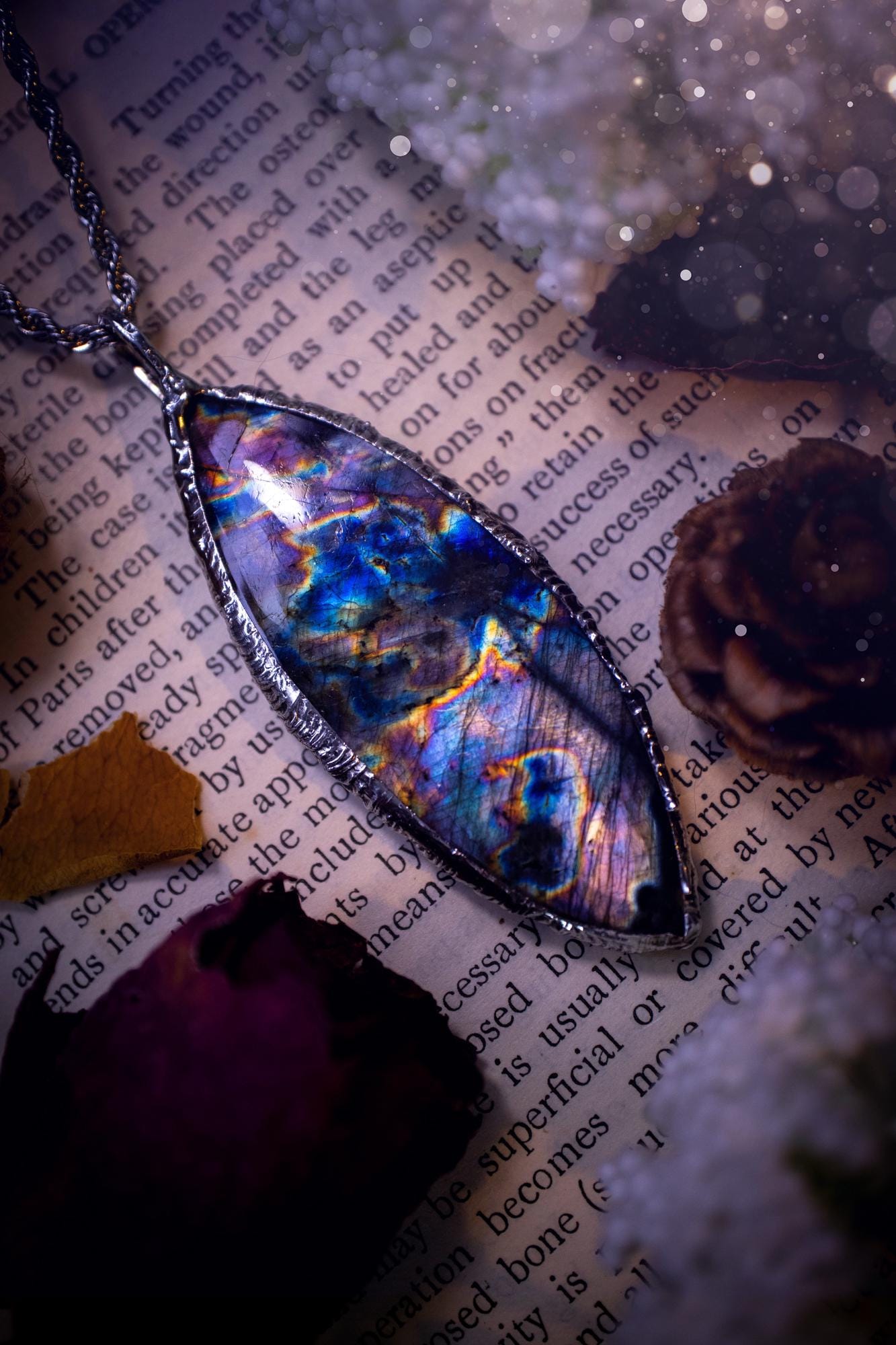 The ultimate labradorite spectrolite, soft soldered pendant necklace. This pendant necklace features the most beautiful and natural Labradorite spectrolite crystal that has so many hues of purple, blues and silvers. Handmade using the tiffany technique, also known as soft soldering. This piece is made from solder which contains metals and silver and is safe to wear. The ideal gift for any jewellery lover and crystal collector! Witchy, gothic and hippy jewellery that has been made for the soul.