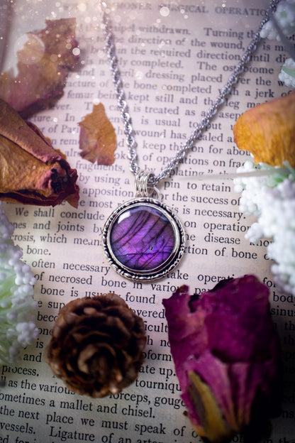 Beautifully handcrafted, deep purple, pink and blue multi-flash labradorite, spectrolite crystal pendant necklace. This stunning crystal pendant has been made using recycled fine and sterling silver. Featuring a stunning and vibrant purple and pink flash labradorite that has the most beautiful stripey patterns within. This crystal pendant would be an ideal gift for any crystal or jewellery lover, which has the a mix of hippy and witch vibes!