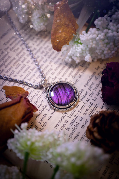 Beautifully handcrafted, deep purple, pink and blue multi-flash labradorite, spectrolite crystal pendant necklace. This stunning crystal pendant has been made using recycled fine and sterling silver. Featuring a stunning and vibrant purple and pink flash labradorite that has the most beautiful stripey patterns within. This crystal pendant would be an ideal gift for any crystal or jewellery lover, which has the a mix of hippy and witch vibes!