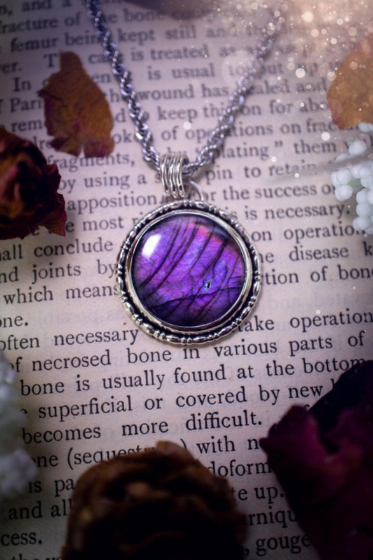 Beautifully handcrafted, deep purple, pink and blue multi-flash labradorite, spectrolite crystal pendant necklace. This stunning crystal pendant has been made using recycled fine and sterling silver. Featuring a stunning and vibrant purple and pink flash labradorite that has the most beautiful stripey patterns within. This crystal pendant would be an ideal gift for any crystal or jewellery lover, which has the a mix of hippy and witch vibes!