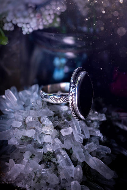 Handcrafted sterling silver statement ring featuring a stunning spectrolite labradorite crystal with vibrant flashes of purple, pink, and orange. This magical gemstone shimmers with an ethereal glow, making it a captivating piece for any jewellery collection. Ideal for crystal lovers, spiritual souls, and those drawn to unique, one-of-a-kind designs. A bold, mystical accessory perfect for expressing your inner light and energy. Gothic and handmade jewellery gifts, ideal for crystal lovers.
