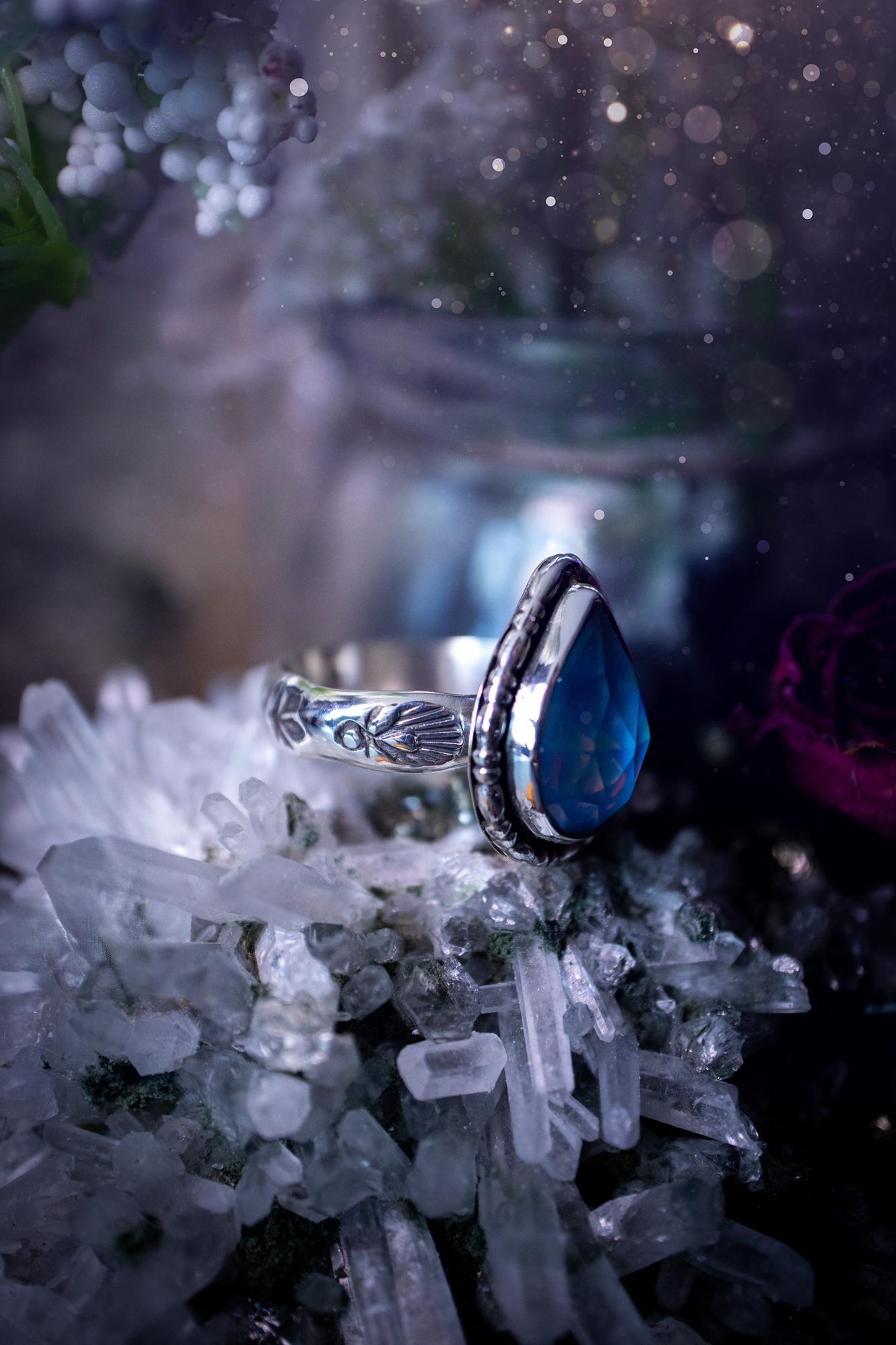 Beautiful and handmade, aurora synthetic opal, sterling silver bespoke ring. This ring has been handmade using a mix of recycled fine and sterling silver. Featuring a beautiful multi flash aurora opal that is full of blue, greens and pink hues depending on the angle. The stone is also rose cut and has a lovely sparkle. This piece is ideal for any jewellery or crystal lover and is full of witchy and hippy vibes! A beautiful mini statement ring for anyone&#39;s collection.