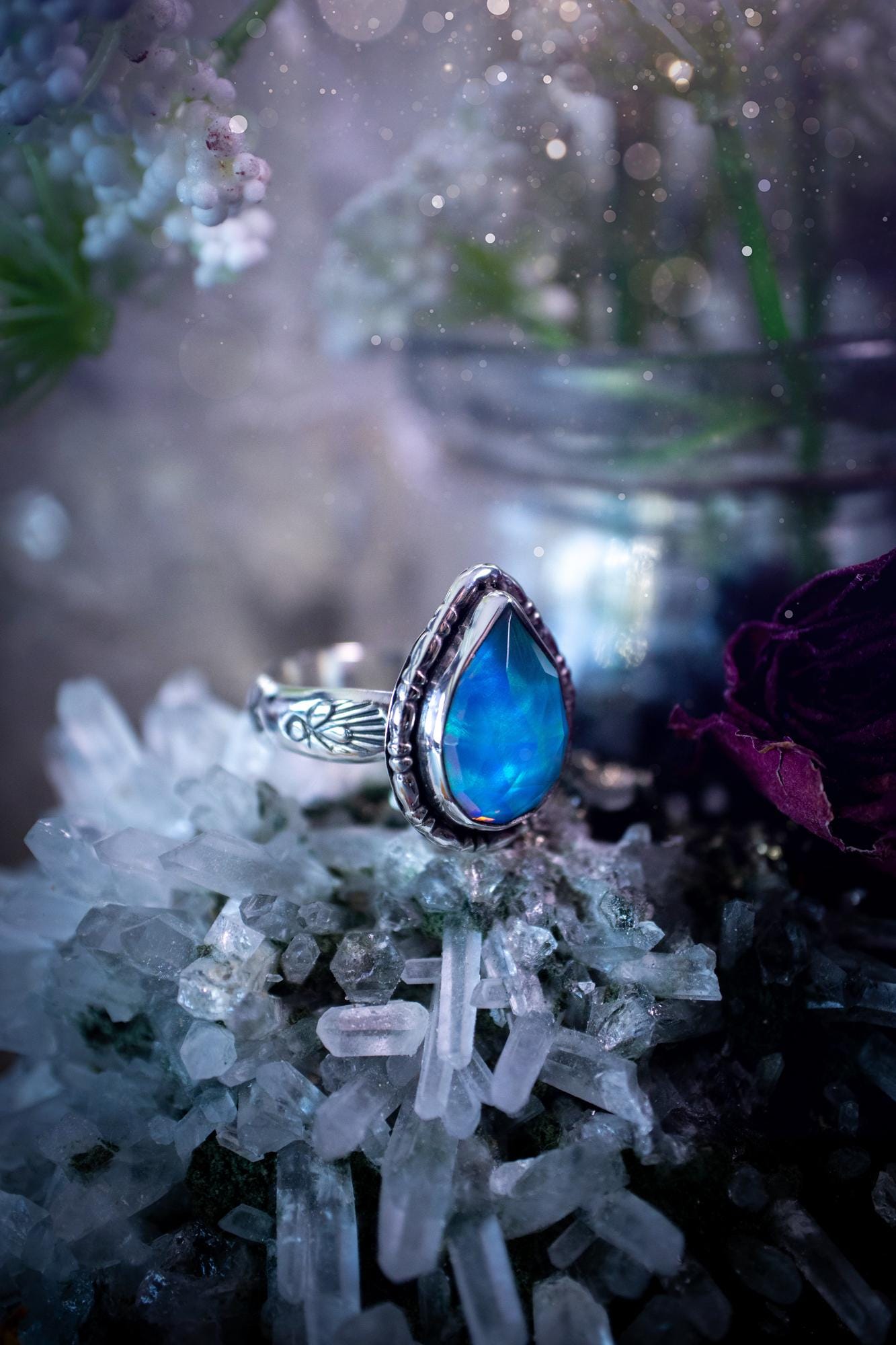 Beautiful and handmade, aurora synthetic opal, sterling silver bespoke ring. This ring has been handmade using a mix of recycled fine and sterling silver. Featuring a beautiful multi flash aurora opal that is full of blue, greens and pink hues depending on the angle. The stone is also rose cut and has a lovely sparkle. This piece is ideal for any jewellery or crystal lover and is full of witchy and hippy vibes! A beautiful mini statement ring for anyone&#39;s collection.
