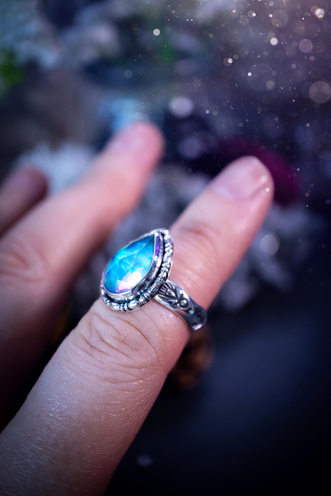 Beautiful and handmade, aurora synthetic opal, sterling silver bespoke ring. This ring has been handmade using a mix of recycled fine and sterling silver. Featuring a beautiful multi flash aurora opal that is full of blue, greens and pink hues depending on the angle. The stone is also rose cut and has a lovely sparkle. This piece is ideal for any jewellery or crystal lover and is full of witchy and hippy vibes! A beautiful mini statement ring for anyone&#39;s collection.