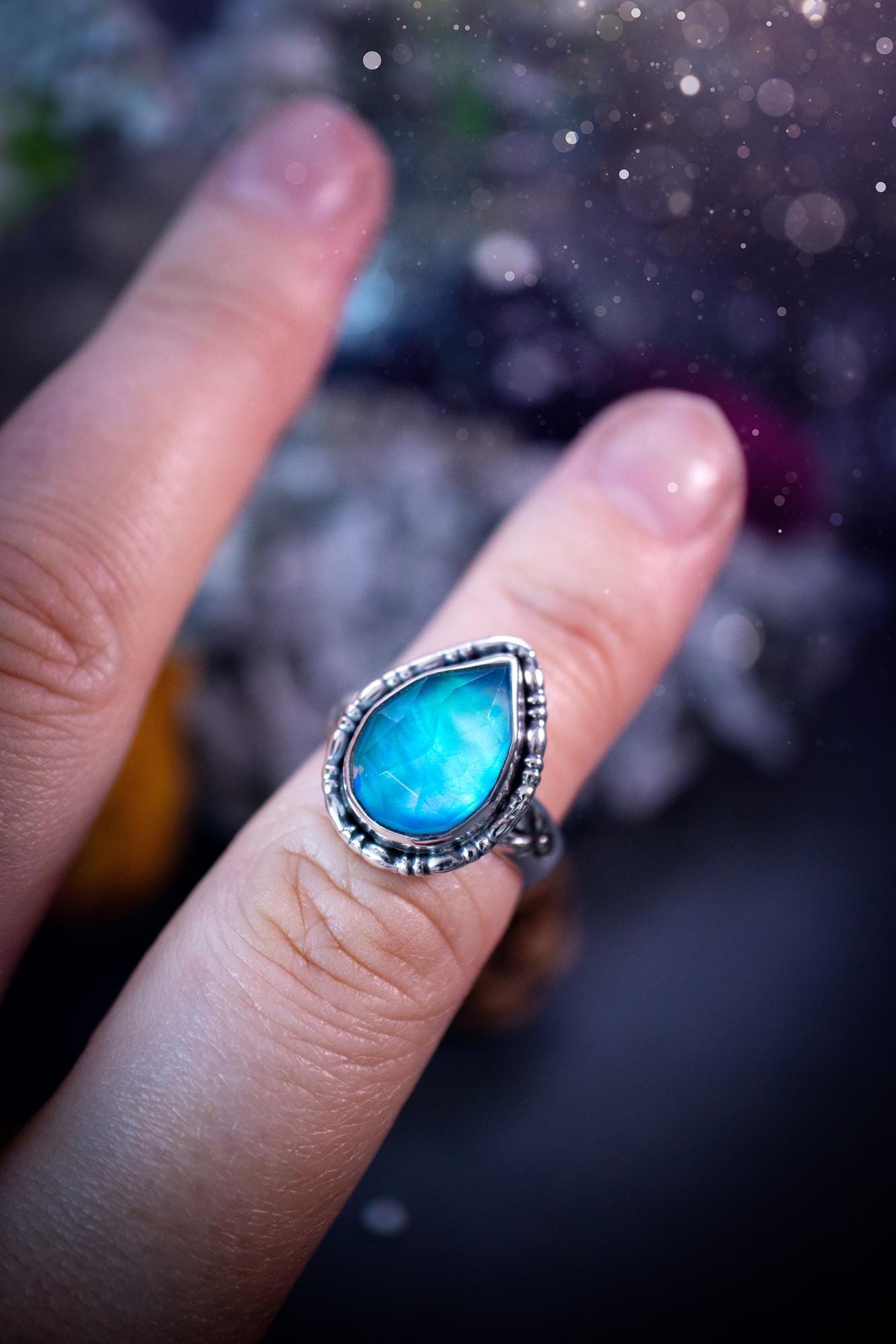 Beautiful and handmade, aurora synthetic opal, sterling silver bespoke ring. This ring has been handmade using a mix of recycled fine and sterling silver. Featuring a beautiful multi flash aurora opal that is full of blue, greens and pink hues depending on the angle. The stone is also rose cut and has a lovely sparkle. This piece is ideal for any jewellery or crystal lover and is full of witchy and hippy vibes! A beautiful mini statement ring for anyone&#39;s collection.