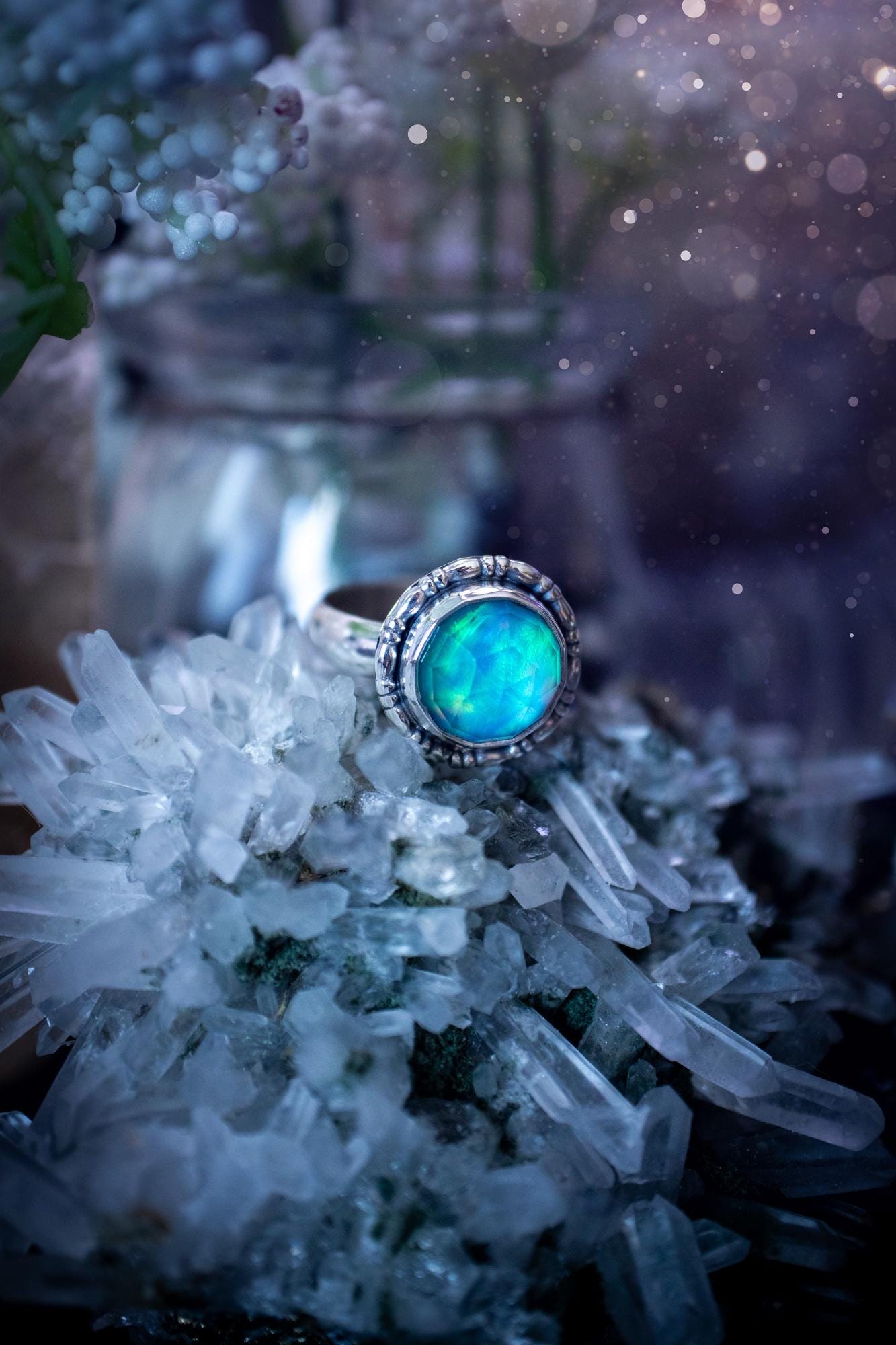 Beautiful and handmade, aurora synthetic opal, sterling silver bespoke ring. This ring has been handmade using a mix of recycled fine and sterling silver. Featuring a beautiful multi flash aurora opal that is full of blue, greens and pink hues depending on the angle. The stone is also rose cut and has a lovely sparkle. This piece is ideal for any jewellery or crystal lover and is full of witchy and hippy vibes! A beautiful mini statement ring for anyone&#39;s collection.