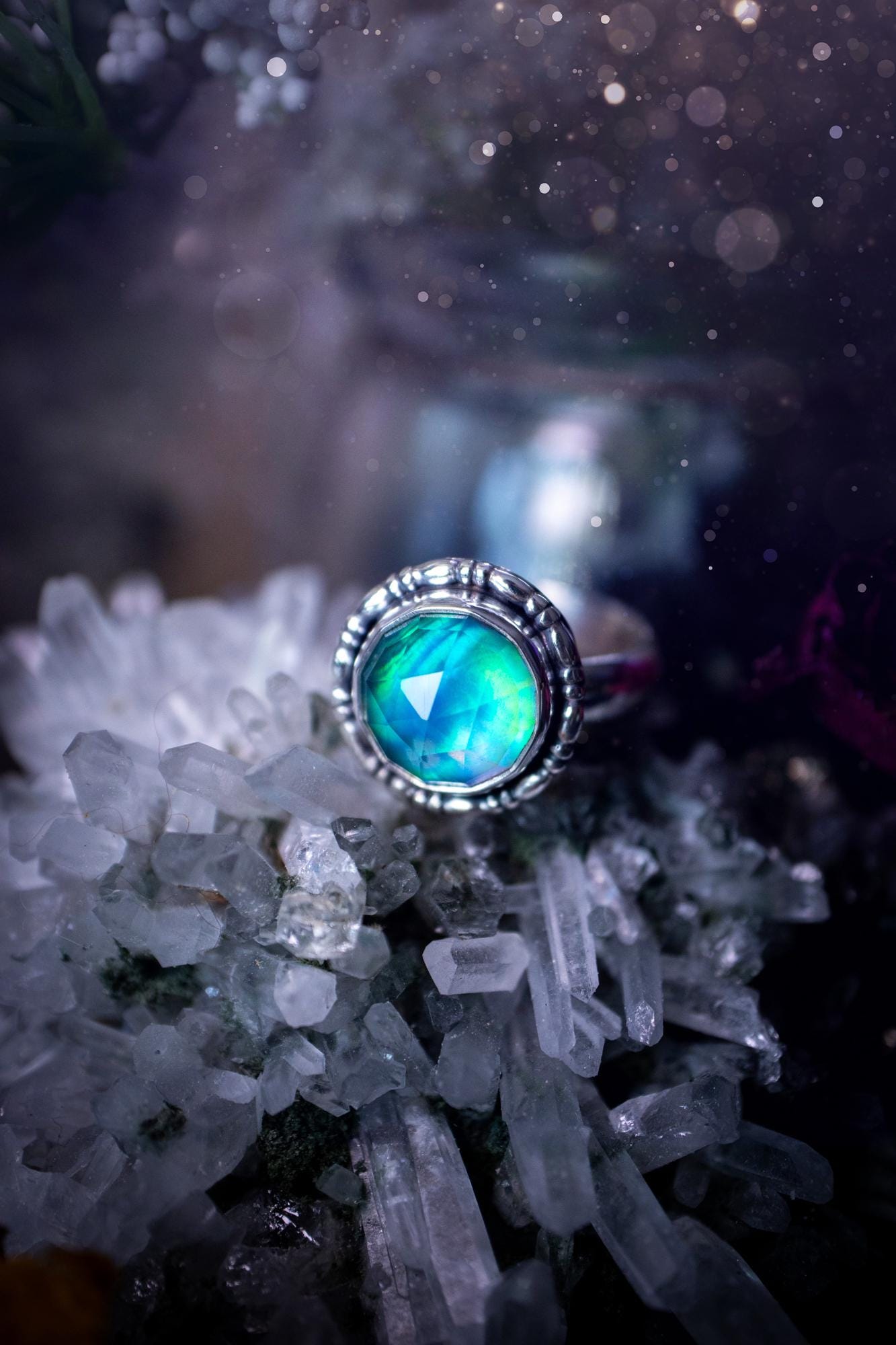 Beautiful and handmade, aurora synthetic opal, sterling silver bespoke ring. This ring has been handmade using a mix of recycled fine and sterling silver. Featuring a beautiful multi flash aurora opal that is full of blue, greens and pink hues depending on the angle. The stone is also rose cut and has a lovely sparkle. This piece is ideal for any jewellery or crystal lover and is full of witchy and hippy vibes! A beautiful mini statement ring for anyone&#39;s collection.