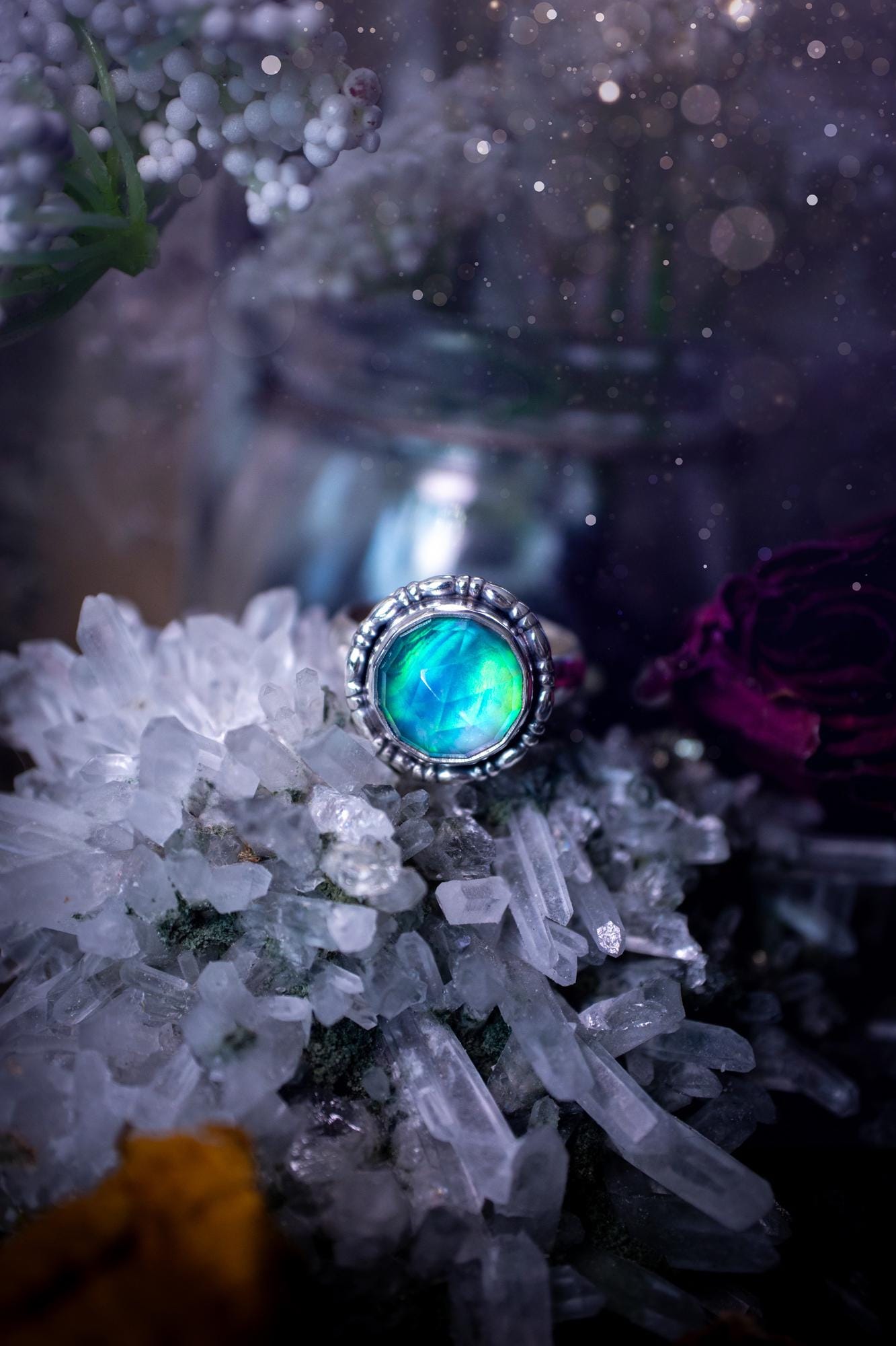 Beautiful and handmade, aurora synthetic opal, sterling silver bespoke ring. This ring has been handmade using a mix of recycled fine and sterling silver. Featuring a beautiful multi flash aurora opal that is full of blue, greens and pink hues depending on the angle. The stone is also rose cut and has a lovely sparkle. This piece is ideal for any jewellery or crystal lover and is full of witchy and hippy vibes! A beautiful mini statement ring for anyone&#39;s collection.