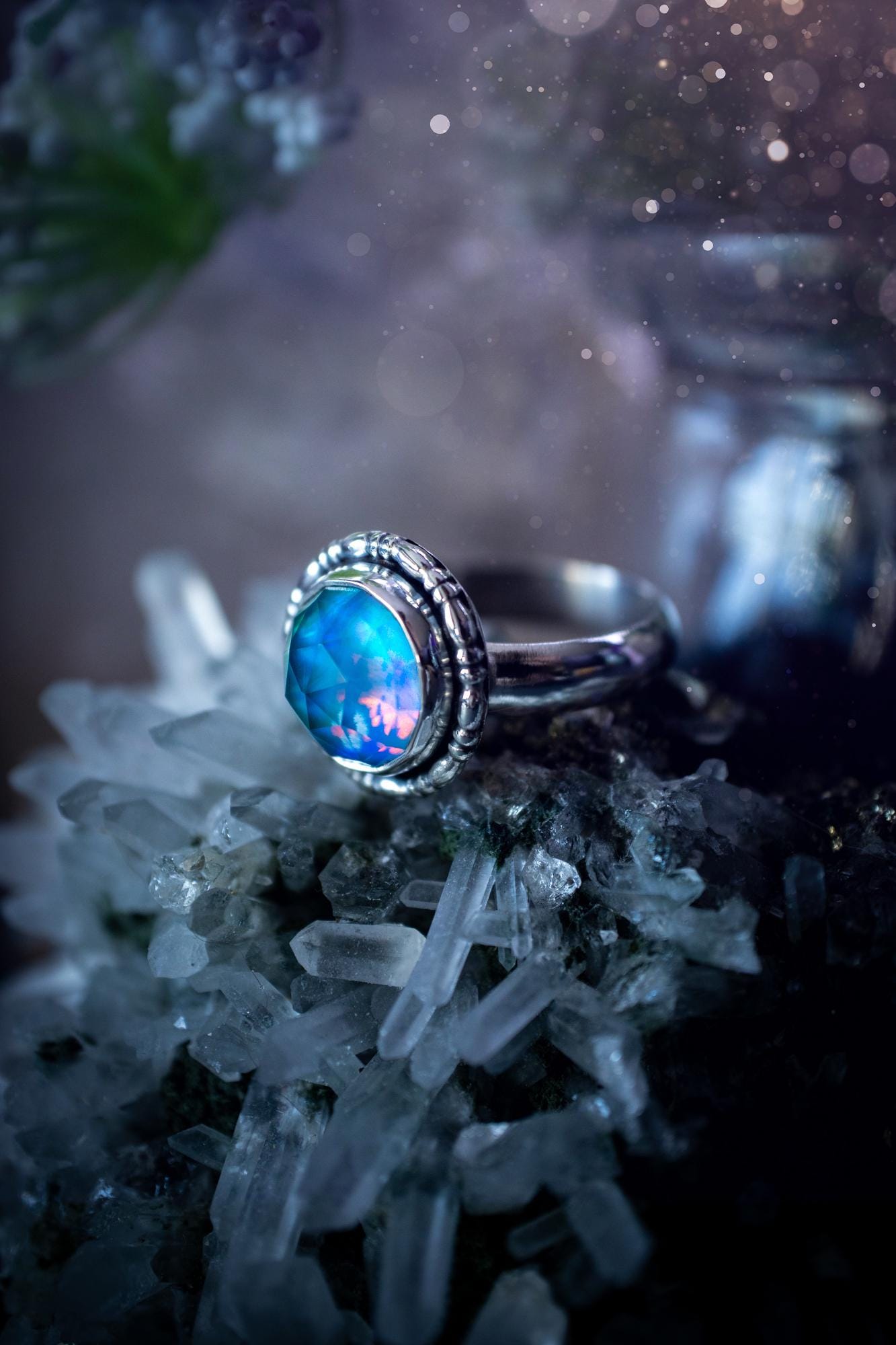 Beautiful and handmade, aurora synthetic opal, sterling silver bespoke ring. This ring has been handmade using a mix of recycled fine and sterling silver. Featuring a beautiful multi flash aurora opal that is full of blue, greens and pink hues depending on the angle. The stone is also rose cut and has a lovely sparkle. This piece is ideal for any jewellery or crystal lover and is full of witchy and hippy vibes! A beautiful mini statement ring for anyone&#39;s collection.