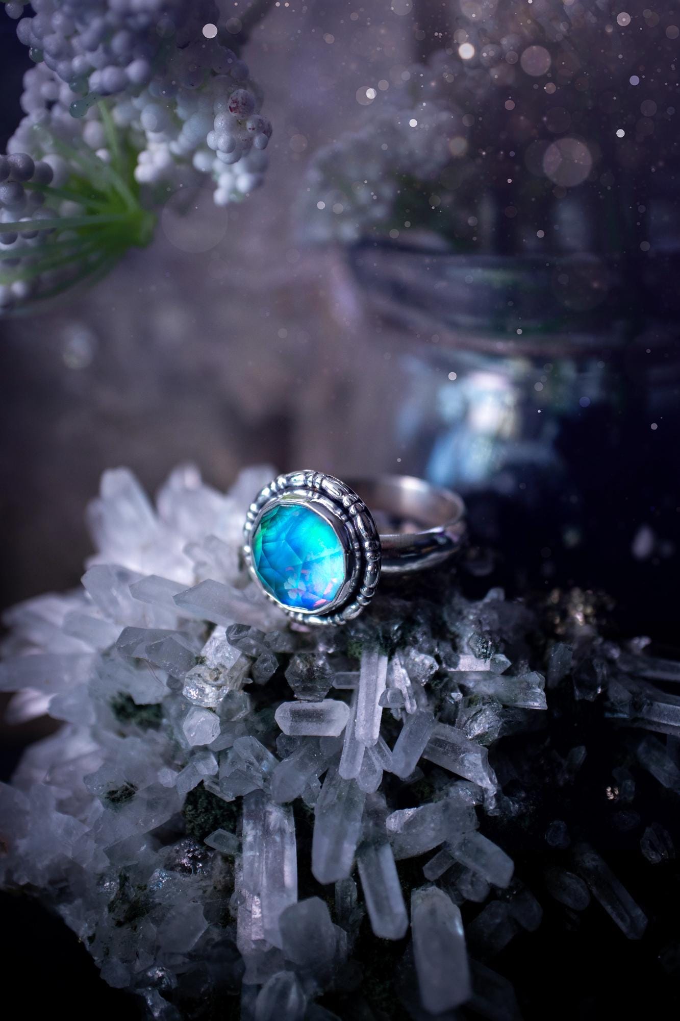 Beautiful and handmade, aurora synthetic opal, sterling silver bespoke ring. This ring has been handmade using a mix of recycled fine and sterling silver. Featuring a beautiful multi flash aurora opal that is full of blue, greens and pink hues depending on the angle. The stone is also rose cut and has a lovely sparkle. This piece is ideal for any jewellery or crystal lover and is full of witchy and hippy vibes! A beautiful mini statement ring for anyone&#39;s collection.