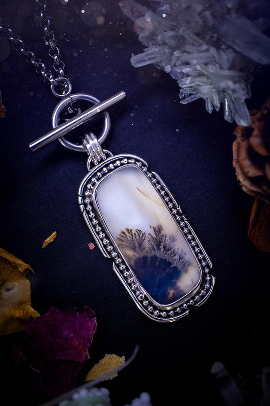 Stunning, bespoke and natural, scenic dendritic agate, sterling silver statement pendant necklace. This pendant necklace has been handmade using fine and sterling silver. It features a beautiful scenic dendritic agate that has a beautiful pattern that looks similar to little trees, a very unique and one of a kind jewellery piece. Around the crystal is a smooth bezel with smooth  and beaded wire. A lovely gift for any crystal and jewellery lover. This piece has a witchy and gothic vibes, hippy.