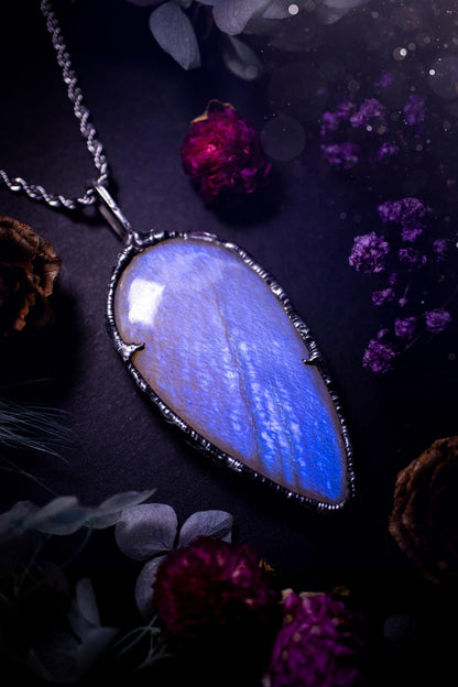 Handmade and beautiful, flashy belomorite, soft soldered pendant necklace. This pendant necklace features the most gorgeous and flashy belomorite moonstone crystal, full of glittery shimmer and a deep lovely blue hue. Handcrafted using the soft solder method, also known as the tiffany technique, an ancient technique used to created stained glass windows. The solder used is lead free and totally safe to wear, it contains elements of silver and polishes up to a high lustre. Gothic witchy jewellery