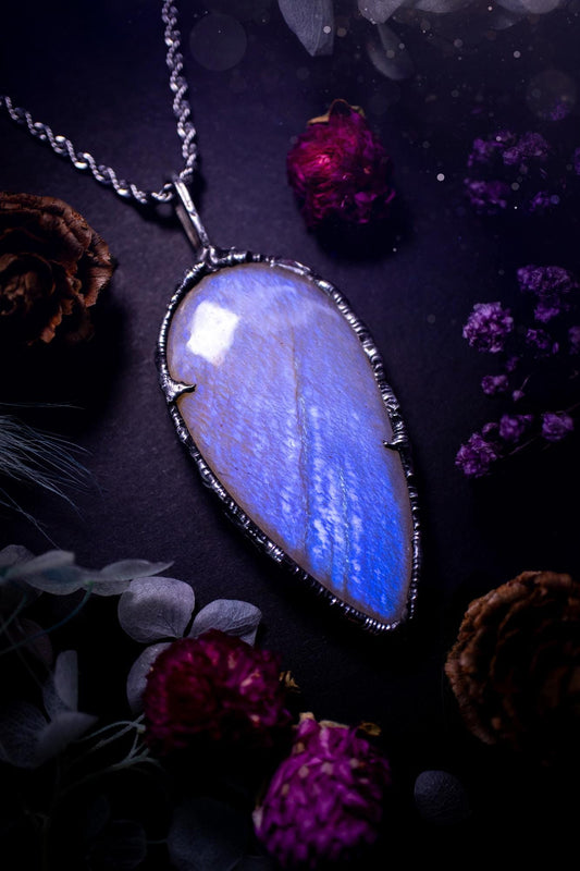 Handmade and beautiful, flashy belomorite, soft soldered pendant necklace. This pendant necklace features the most gorgeous and flashy belomorite moonstone crystal, full of glittery shimmer and a deep lovely blue hue. Handcrafted using the soft solder method, also known as the tiffany technique, an ancient technique used to created stained glass windows. The solder used is lead free and totally safe to wear, it contains elements of silver and polishes up to a high lustre. Gothic witchy jewellery