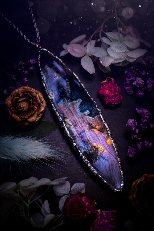 The ultimate labradorite soft soldered pendant necklace. This huge, statement pendant necklace features the most beautiful and natural Labradorite spectrolite crystal that has so many hues of pinks and purples. Handmade using the tiffany technique, also known as soft soldering. This piece is made from solder which contains metals and silver and is safe to wear. The ideal gift for any jewellery lover and crystal collector! Witchy, gothic and hippy jewellery that has been made for the soul.