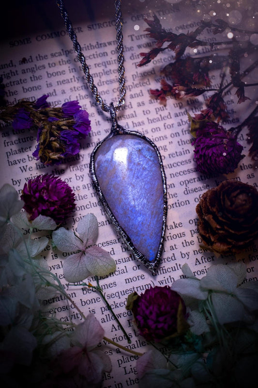 Handmade and beautiful, flashy belomorite, soft soldered pendant necklace. This pendant necklace features the most gorgeous and flashy belomorite moonstone crystal, full of glittery shimmer and a deep lovely blue hue. Handcrafted using the soft solder method, also known as the tiffany technique, an ancient technique used to created stained glass windows. The solder used is lead free and totally safe to wear, it contains elements of silver and polishes up to a high lustre. Gothic witchy jewellery