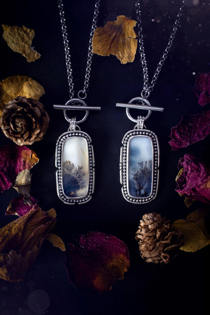 Stunning, bespoke and natural, scenic dendritic agate, sterling silver statement pendant necklace. This pendant necklace has been handmade using fine and sterling silver. It features a beautiful scenic dendritic agate that has a beautiful pattern that looks similar to little trees, a very unique and one of a kind jewellery piece. Around the crystal is a smooth bezel with smooth  and beaded wire. A lovely gift for any crystal and jewellery lover. This piece has a witchy and gothic vibes, hippy.