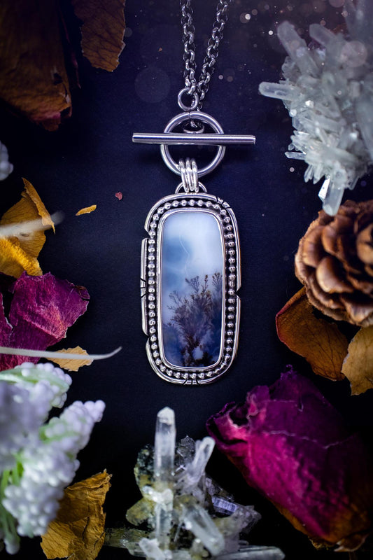Stunning, bespoke and natural, scenic dendritic agate, sterling silver statement pendant necklace. This pendant necklace has been handmade using fine and sterling silver. It features a beautiful scenic dendritic agate that has a beautiful pattern that looks similar to little trees, a very unique and one of a kind jewellery piece. Around the crystal is a smooth bezel with smooth  and beaded wire. A lovely gift for any crystal and jewellery lover. This piece has a witchy and gothic vibes, hippy.