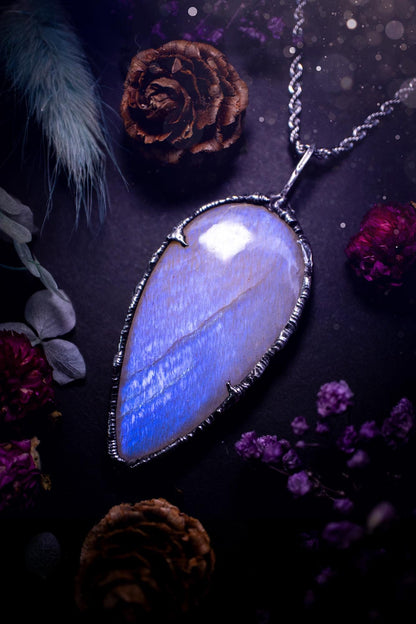 Handmade and beautiful, flashy belomorite, soft soldered pendant necklace. This pendant necklace features the most gorgeous and flashy belomorite moonstone crystal, full of glittery shimmer and a deep lovely blue hue. Handcrafted using the soft solder method, also known as the tiffany technique, an ancient technique used to created stained glass windows. The solder used is lead free and totally safe to wear, it contains elements of silver and polishes up to a high lustre. Gothic witchy jewellery