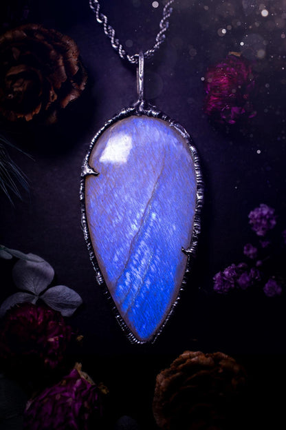 Handmade and beautiful, flashy belomorite, soft soldered pendant necklace. This pendant necklace features the most gorgeous and flashy belomorite moonstone crystal, full of glittery shimmer and a deep lovely blue hue. Handcrafted using the soft solder method, also known as the tiffany technique, an ancient technique used to created stained glass windows. The solder used is lead free and totally safe to wear, it contains elements of silver and polishes up to a high lustre. Gothic witchy jewellery