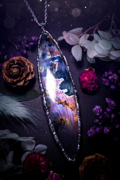 The ultimate labradorite soft soldered pendant necklace. This huge, statement pendant necklace features the most beautiful and natural Labradorite spectrolite crystal that has so many hues of pinks and purples. Handmade using the tiffany technique, also known as soft soldering. This piece is made from solder which contains metals and silver and is safe to wear. The ideal gift for any jewellery lover and crystal collector! Witchy, gothic and hippy jewellery that has been made for the soul.