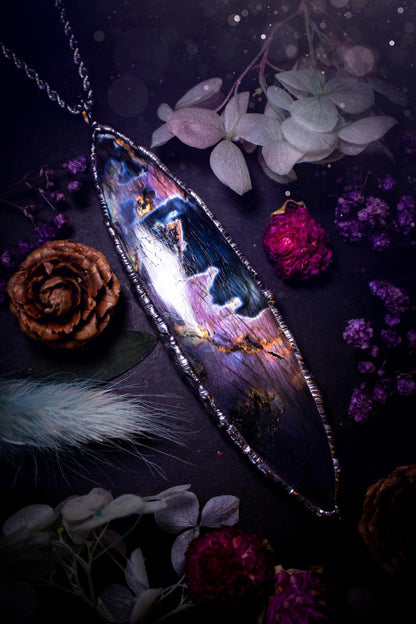 The ultimate labradorite soft soldered pendant necklace. This huge, statement pendant necklace features the most beautiful and natural Labradorite spectrolite crystal that has so many hues of pinks and purples. Handmade using the tiffany technique, also known as soft soldering. This piece is made from solder which contains metals and silver and is safe to wear. The ideal gift for any jewellery lover and crystal collector! Witchy, gothic and hippy jewellery that has been made for the soul.