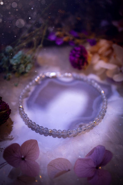 Beautifully handmade, and customisable, high grade aquamarine crystal bead, stacking bracelet. This dainty crystal bracelet features high grade, genuine, smooth, aquamarine crystal beads which give off a beautiful shimmer. Strung on 49 strand beading wire with a choice of customisable findings to suit your style. Ideal for gifting, and suitable for any crystal and jewellery lover. Celestial, witchy and gothic.