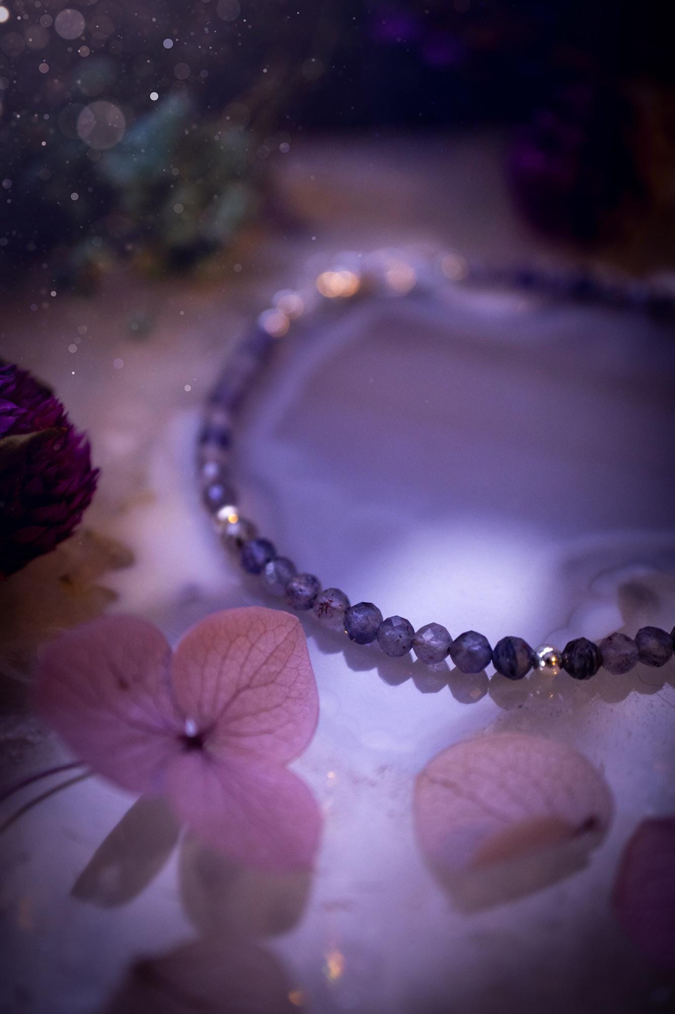 Beautifully handmade, and customisable, iolite crystal bead, stacking bracelet. This dainty crystal bracelet features high grade, genuine, rose cut, iolite crystal beads which give off a beautiful sparkle. They are a lovely purple and blue hue full of vibrancy. Strung on 49 strand beading wire with a choice of customisable findings to suit your style. Ideal for gifting, and suitable for any crystal and jewellery lover. Celestial, witchy and gothic.