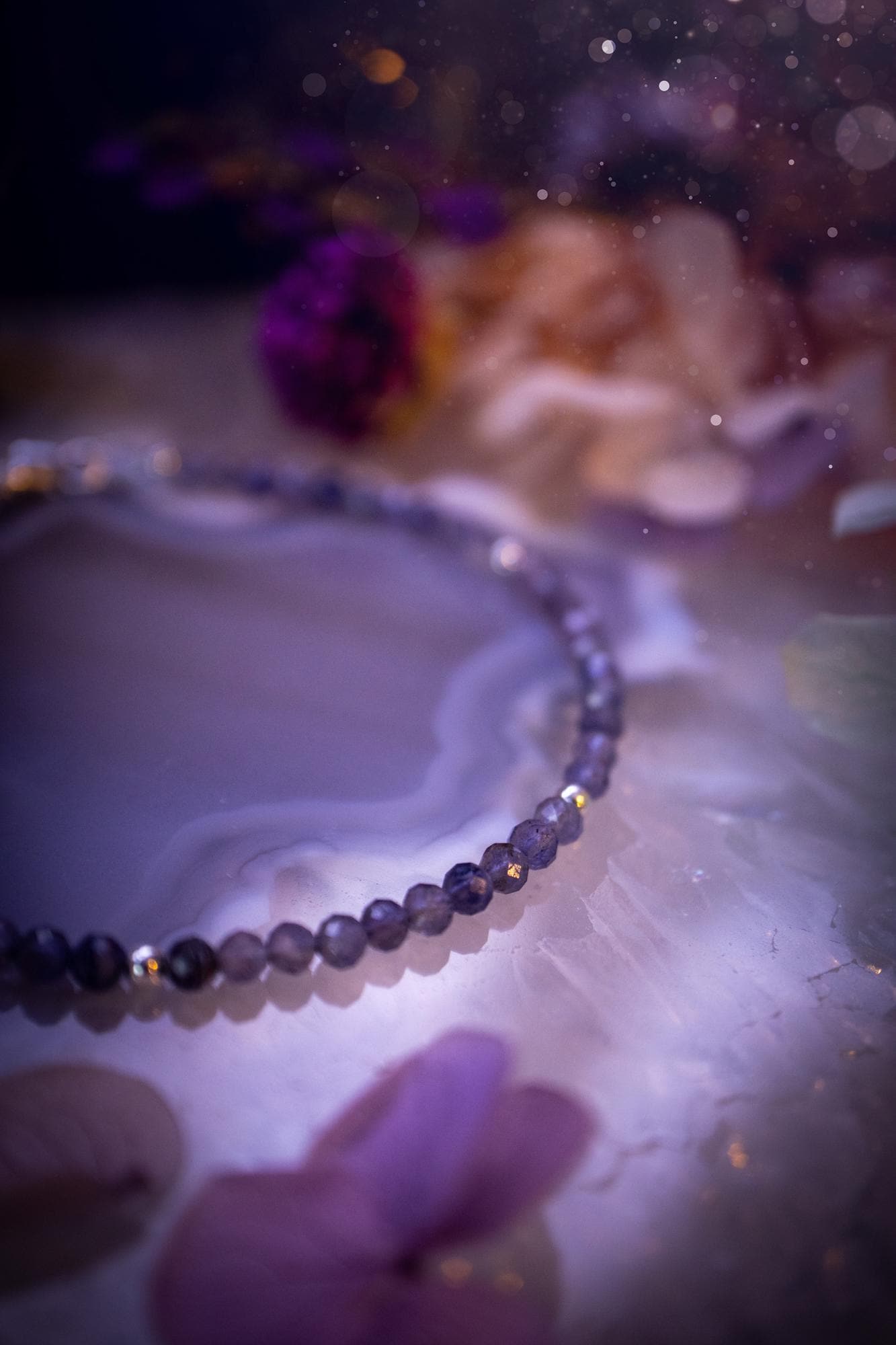 Beautifully handmade, and customisable, iolite crystal bead, stacking bracelet. This dainty crystal bracelet features high grade, genuine, rose cut, iolite crystal beads which give off a beautiful sparkle. They are a lovely purple and blue hue full of vibrancy. Strung on 49 strand beading wire with a choice of customisable findings to suit your style. Ideal for gifting, and suitable for any crystal and jewellery lover. Celestial, witchy and gothic.