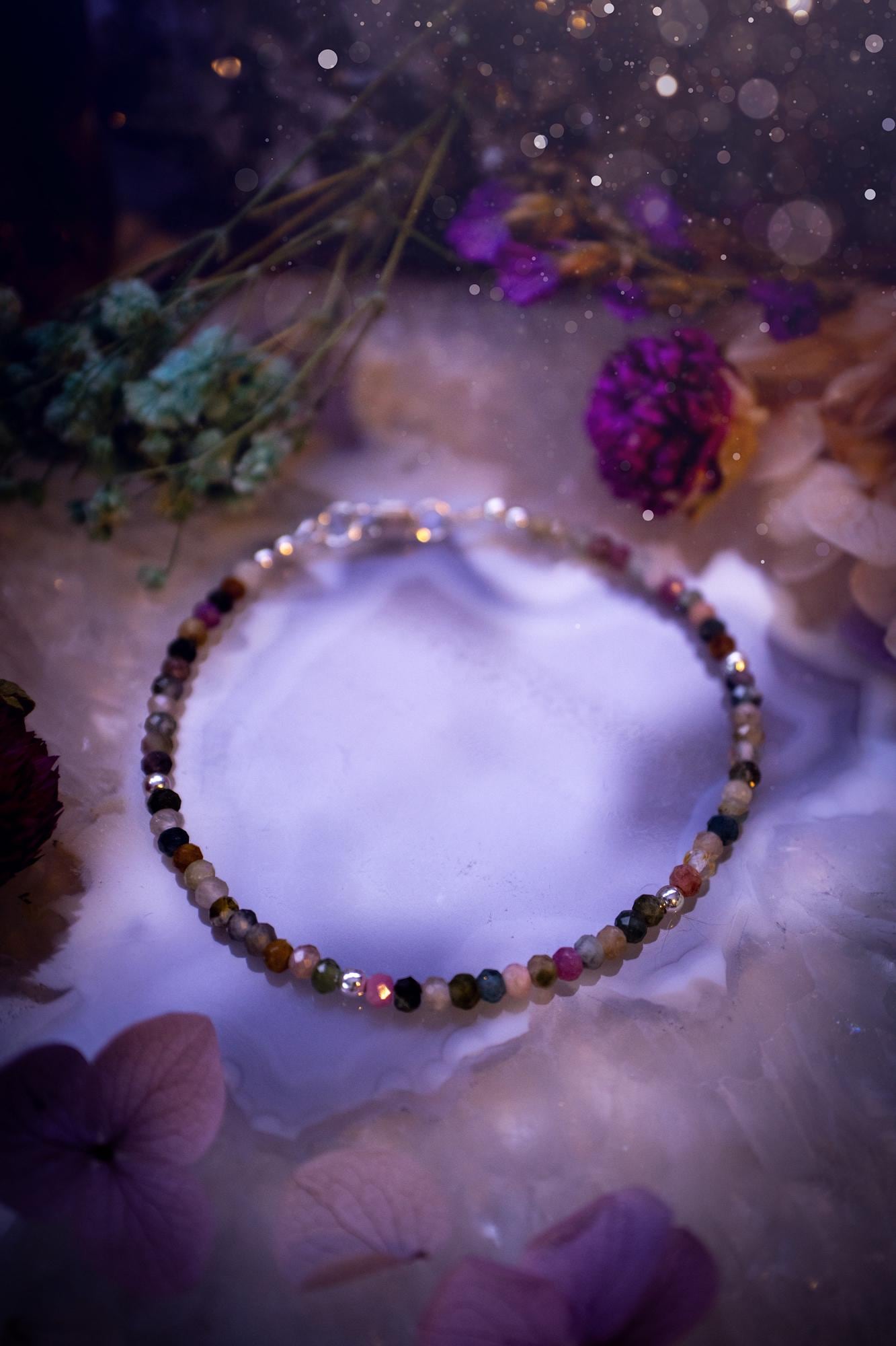 Beautifully handmade, and customisable, mixed tourmaline crystal bead, stacking bracelet. This dainty crystal bracelet features high grade, genuine, rose cut, tourmaline crystal beads which give off a beautiful sparkle. They are a lovely mix of hue, full of vibrancy. Strung on 49 strand beading wire with a choice of customisable findings to suit your style. Ideal for gifting, and suitable for any crystal and jewellery lover. Celestial, witchy and gothic.