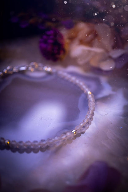 Beautifully handmade, and customisable, clear quartz crystal bead, stacking bracelet. This dainty crystal bracelet features high grade, genuine, rose cut, quartz crystal beads which give off a beautiful sparkle. Strung on 49 strand beading wire with a choice of customisable findings to suit your style. Ideal for gifting, and suitable for any crystal and jewellery lover. Celestial, witchy and gothic.