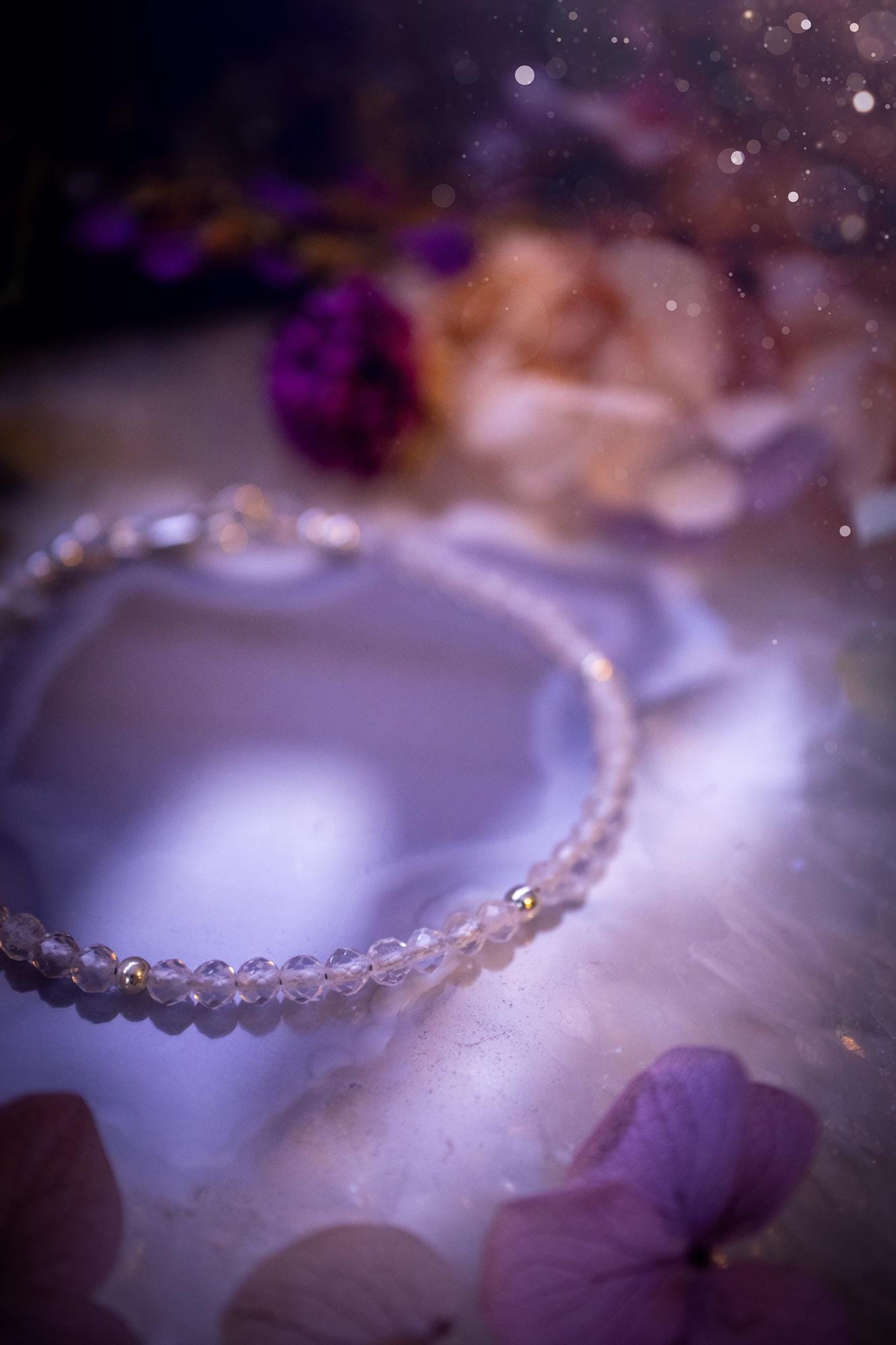 Beautifully handmade, and customisable, clear quartz crystal bead, stacking bracelet. This dainty crystal bracelet features high grade, genuine, rose cut, quartz crystal beads which give off a beautiful sparkle. Strung on 49 strand beading wire with a choice of customisable findings to suit your style. Ideal for gifting, and suitable for any crystal and jewellery lover. Celestial, witchy and gothic.