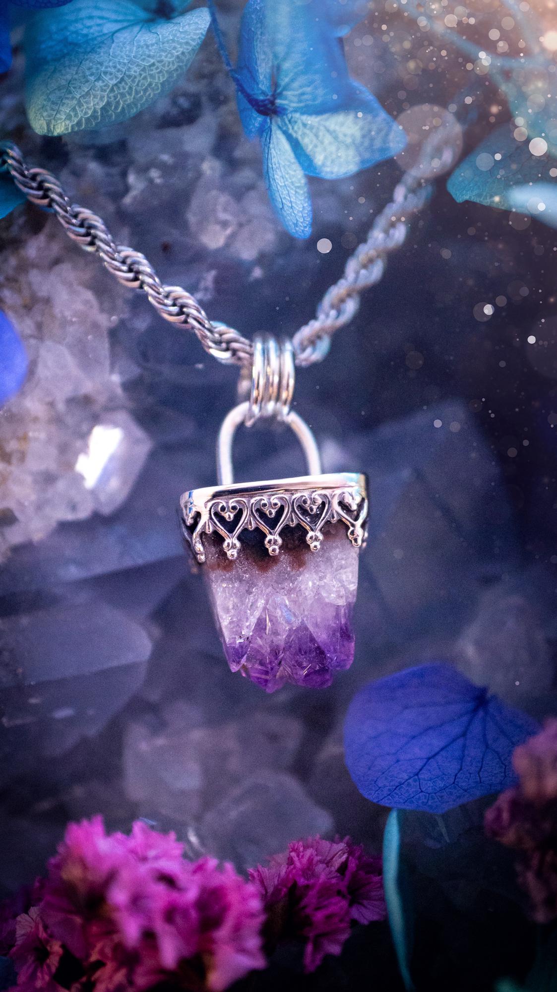 Handmade and beautiful, natural amethyst crystal cluster pendant necklace. This lovely piece of jewellery is made from a mix of fine and sterling silver. It features a beautiful mini amethyst crystal cluster that has lots of formations and rainbows within the inclusions! Full of sparkle with a lovely deep purple hue at the points. This piece of jewellery would be ideal for any crystal and jewellery lover, or even for birthdays as amethyst is the birthstone for February. Gothic and witchy