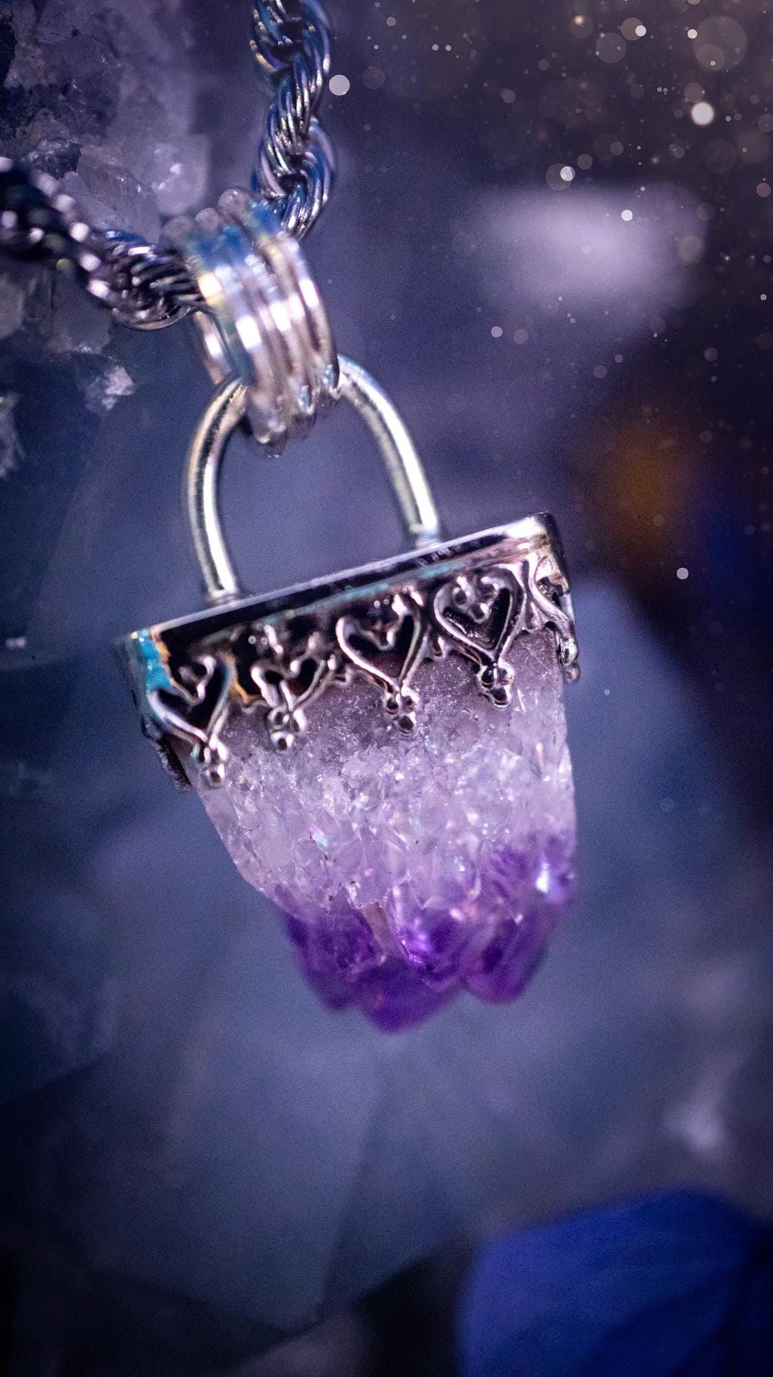 Handmade and beautiful, natural amethyst crystal cluster pendant necklace. This lovely piece of jewellery is made from a mix of fine and sterling silver. It features a beautiful mini amethyst crystal cluster that has lots of formations and rainbows within the inclusions! Full of sparkle with a lovely deep purple hue at the points. This piece of jewellery would be ideal for any crystal and jewellery lover, or even for birthdays as amethyst is the birthstone for February. Gothic and witchy