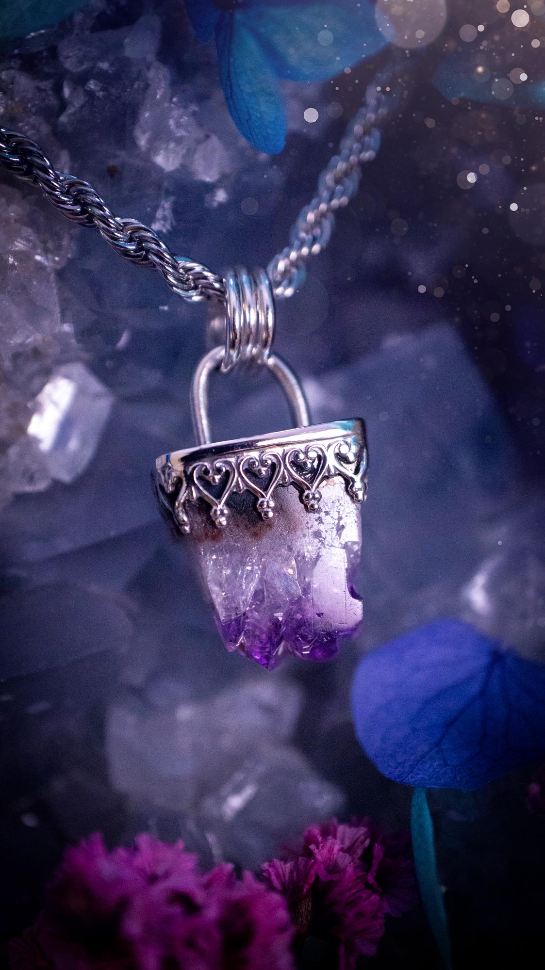 Handmade and beautiful, natural amethyst crystal cluster pendant necklace. This lovely piece of jewellery is made from a mix of fine and sterling silver. It features a beautiful mini amethyst crystal cluster that has lots of formations and rainbows within the inclusions! Full of sparkle with a lovely deep purple hue at the points. This piece of jewellery would be ideal for any crystal and jewellery lover, or even for birthdays as amethyst is the birthstone for February. Gothic and witchy