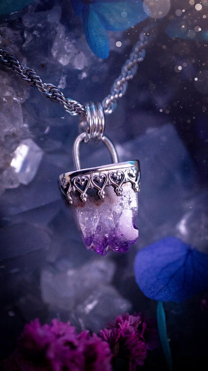 Handmade and beautiful, natural amethyst crystal cluster pendant necklace. This lovely piece of jewellery is made from a mix of fine and sterling silver. It features a beautiful mini amethyst crystal cluster that has lots of formations and rainbows within the inclusions! Full of sparkle with a lovely deep purple hue at the points. This piece of jewellery would be ideal for any crystal and jewellery lover, or even for birthdays as amethyst is the birthstone for February. Gothic and witchy