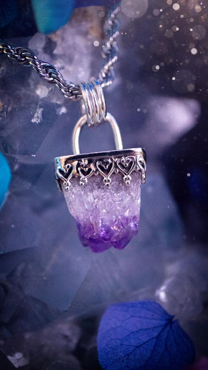 Handmade and beautiful, natural amethyst crystal cluster pendant necklace. This lovely piece of jewellery is made from a mix of fine and sterling silver. It features a beautiful mini amethyst crystal cluster that has lots of formations and rainbows within the inclusions! Full of sparkle with a lovely deep purple hue at the points. This piece of jewellery would be ideal for any crystal and jewellery lover, or even for birthdays as amethyst is the birthstone for February. Gothic and witchy