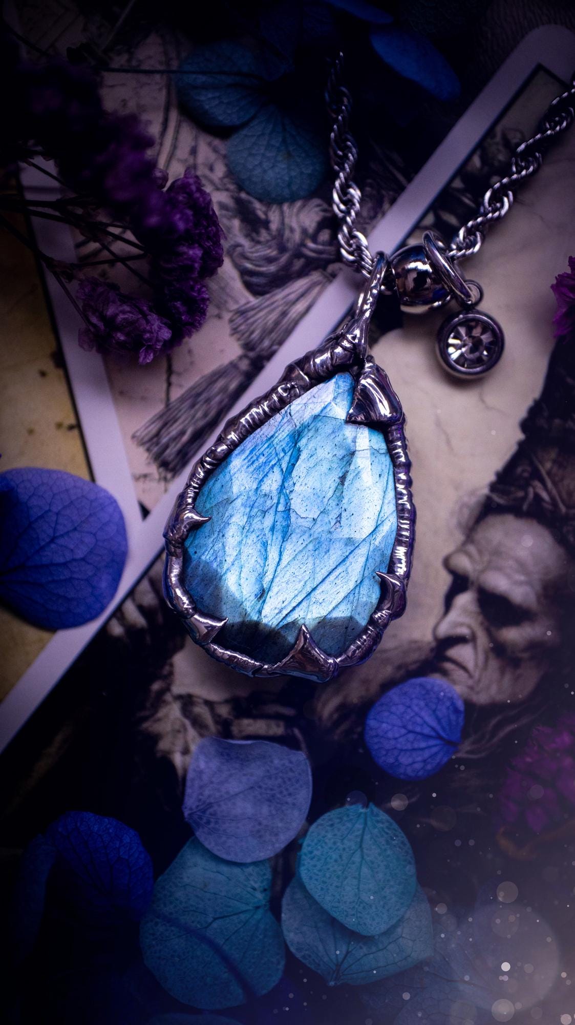 A stunning, and one off pendant necklace. Icy blue labradorite with a facet cut soft soldered pendant. This piece of jewellery has been handmade and features a very high quality, icy blue, natural labradorite crystal. Made using the soft solder method with lead free solder that contains mixed metals including silver. The piece is then polished to a high lustre. Featuring little claws for that gothic and witchy look. Ideal for any crystal and jewellery lover who would like a one of a kind piece.