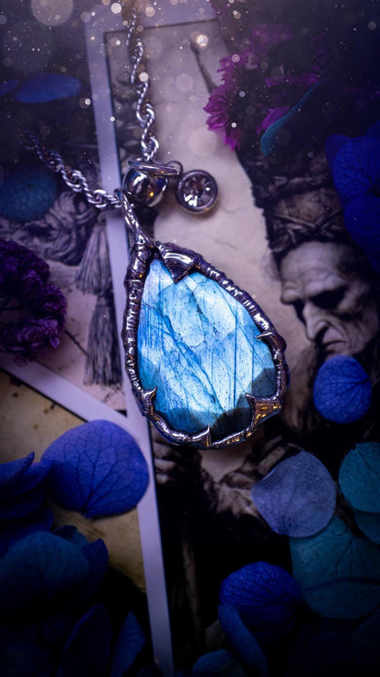 A stunning, and one off pendant necklace. Icy blue labradorite with a facet cut soft soldered pendant. This piece of jewellery has been handmade and features a very high quality, icy blue, natural labradorite crystal. Made using the soft solder method with lead free solder that contains mixed metals including silver. The piece is then polished to a high lustre. Featuring little claws for that gothic and witchy look. Ideal for any crystal and jewellery lover who would like a one of a kind piece.