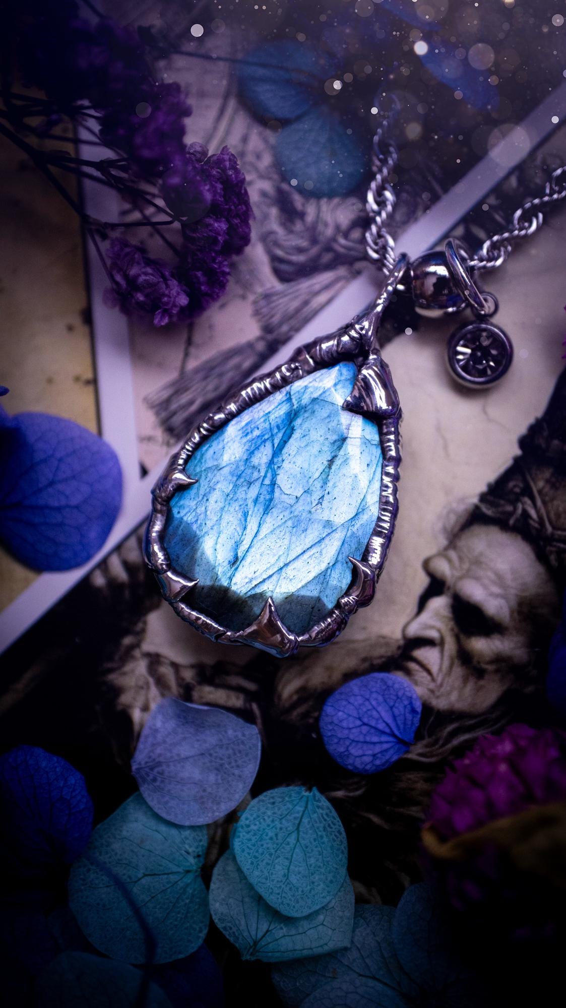 A stunning, and one off pendant necklace. Icy blue labradorite with a facet cut soft soldered pendant. This piece of jewellery has been handmade and features a very high quality, icy blue, natural labradorite crystal. Made using the soft solder method with lead free solder that contains mixed metals including silver. The piece is then polished to a high lustre. Featuring little claws for that gothic and witchy look. Ideal for any crystal and jewellery lover who would like a one of a kind piece.