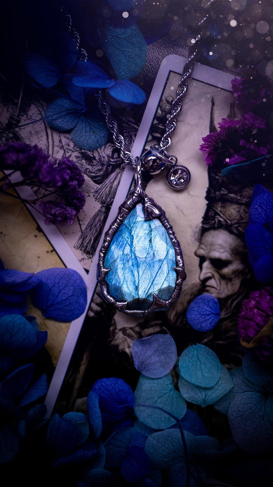 A stunning, and one off pendant necklace. Icy blue labradorite with a facet cut soft soldered pendant. This piece of jewellery has been handmade and features a very high quality, icy blue, natural labradorite crystal. Made using the soft solder method with lead free solder that contains mixed metals including silver. The piece is then polished to a high lustre. Featuring little claws for that gothic and witchy look. Ideal for any crystal and jewellery lover who would like a one of a kind piece.