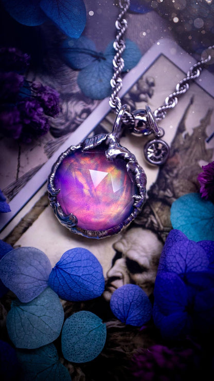 A beautiful, one of a kind, aurora opal pendant necklace. This little statement necklace is handmade using the tiffany technique, also known as soft soldering. Featuring the most stunning, and sparkly aurora opal which is full of pinks, greens and blues just like the northern lights. Aurora opals are man made opals that look similar to natural ones, they have a layer of rose quartz on top to give extra shine. The ideal gift for any crystal or jewellery lover. Gothic and witchy jewellery