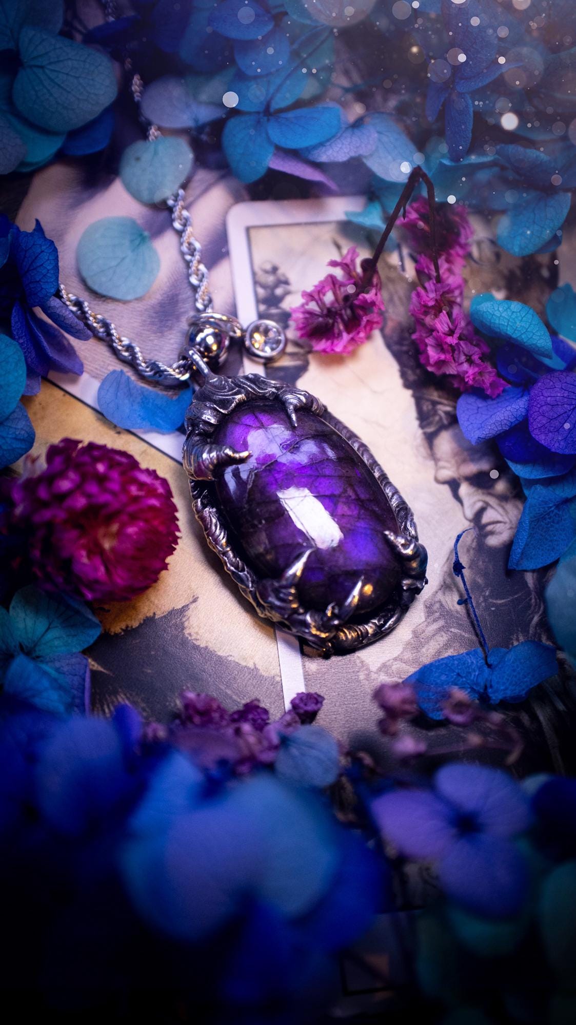 Beautiful and handmade, totally bespoke, purple labradorite pendant necklace. This necklace has been created using the soft solder method with lead free solder for a rustic and gothic look. Featuring a stunning and natural purple blue labradorite crystal. This pendant resembles what I would describe a dragon egg that is being held by the claws off a dragon! Very unique and one off. This piece would make an ideal gift for any crystal or jewellery fan that is into a gothic and witchy vibe!