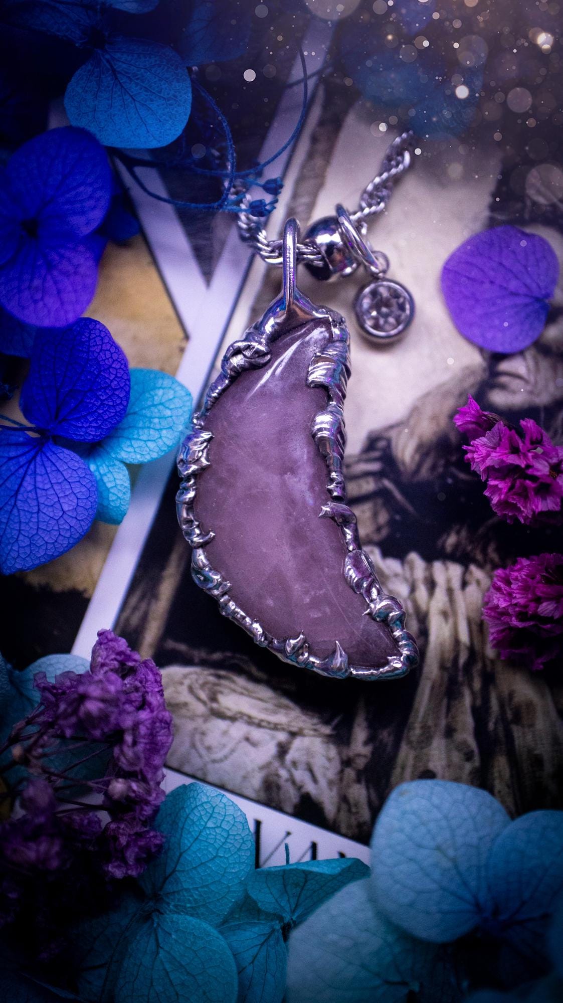 Beautifully bespoke and handcrafted, rose quartz, soft soldered moon pendant necklace. This necklace has been handmade using the soft solder method with lead free solder with mix metals including silver. Featuring a gorgeous rose quartz moon that is a dusty pink colour. This piece is very unique and comes with its own little cubic zirconia charm. This pendant necklace would be suitable for anyone who loves crystals and jewellery, and that also loves a gothic and witchy vibe! Total soul jewellery