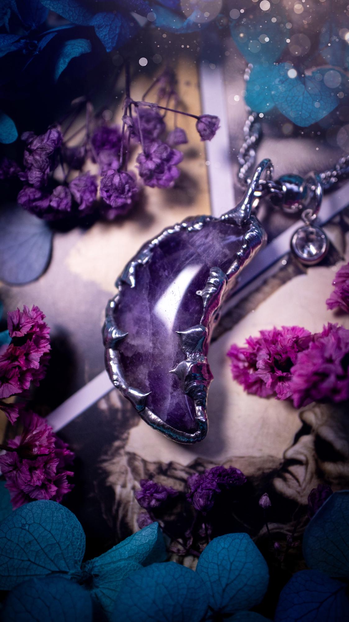 Beautifully bespoke and handcrafted, amethyst, soft soldered moon pendant necklace. This necklace has been handmade using the soft solder method with lead free solder with mix metals including silver. Featuring a gorgeous amethyst moon with stunning patterns. This piece is very unique and comes with its own little cubic zirconia charm. This pendant necklace would be suitable for anyone who loves crystals and jewellery, and that also loves a gothic and witchy vibe! Total soul jewellery